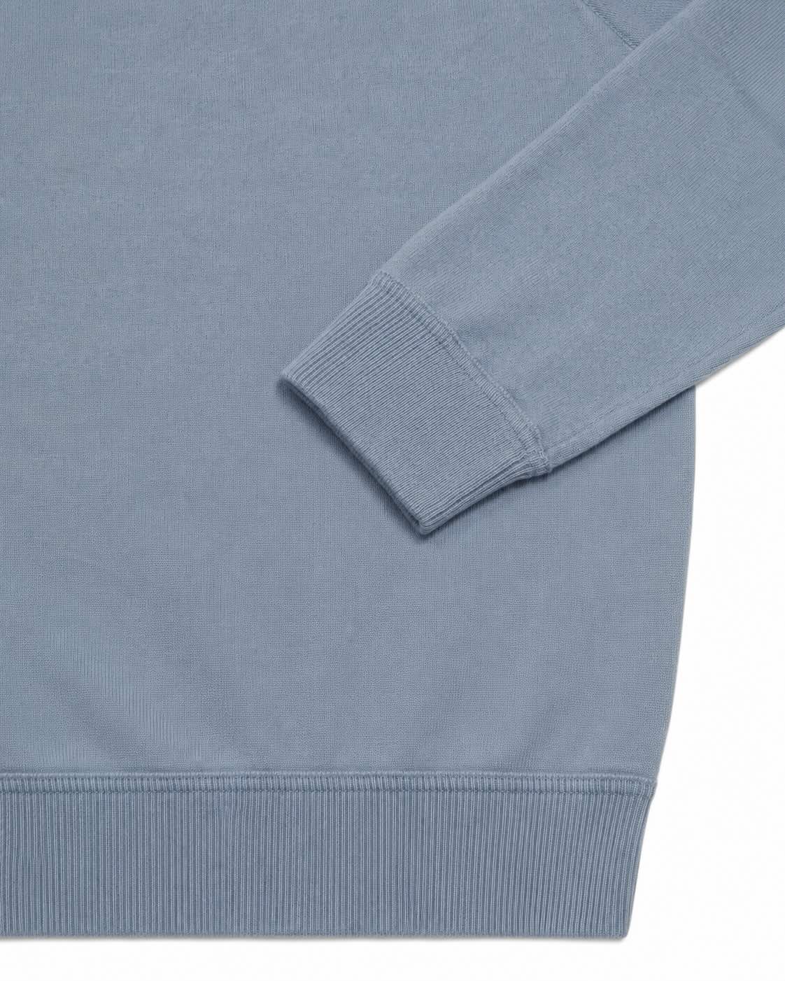 Light blue cashmere round neck sweater with raglan sleeves